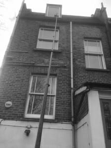 Window cleaning a three storey building with a 35ft carbon fibre pole