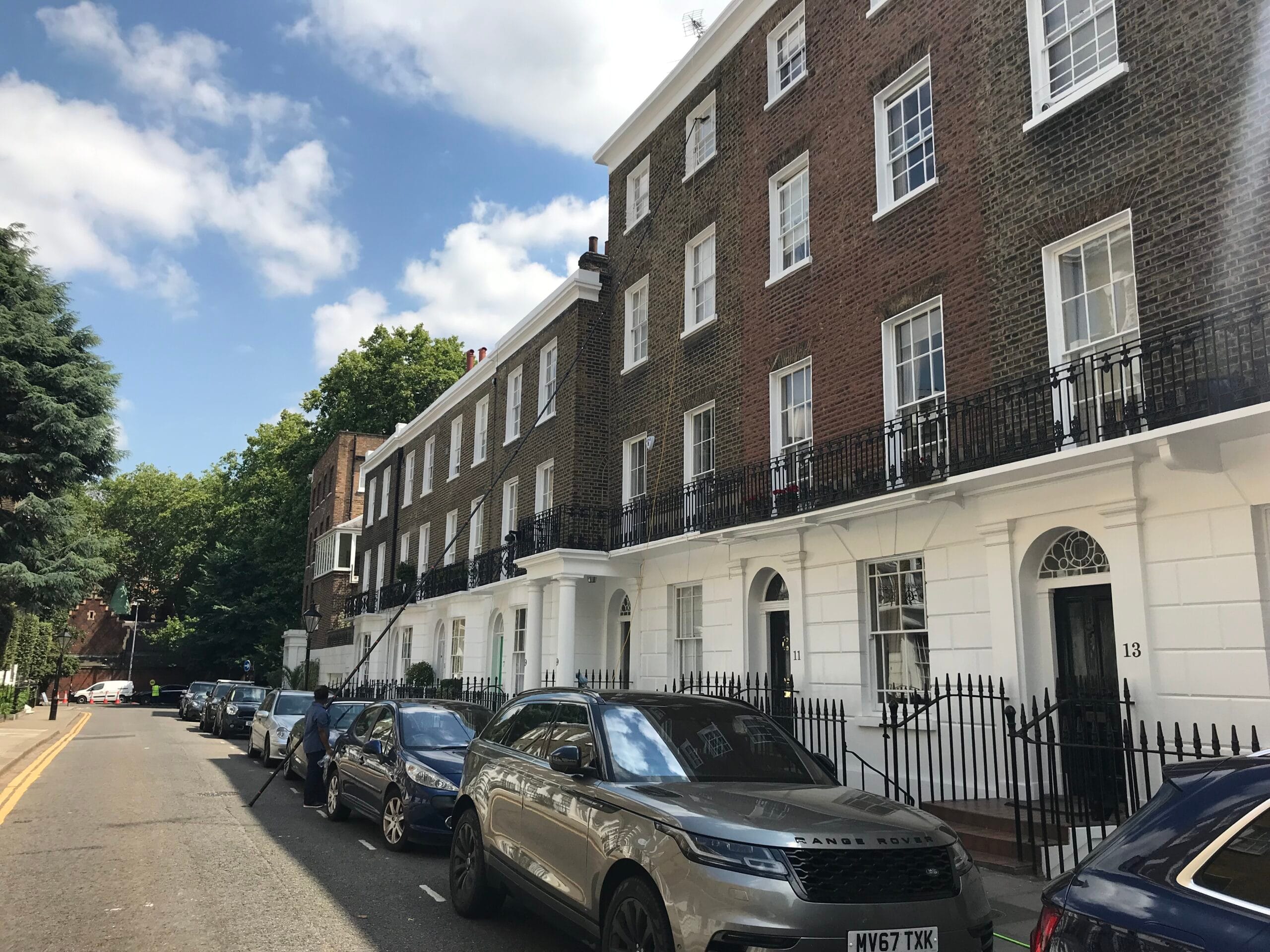 Professional window cleaners working on a Chelsea townhouse in SW3, London